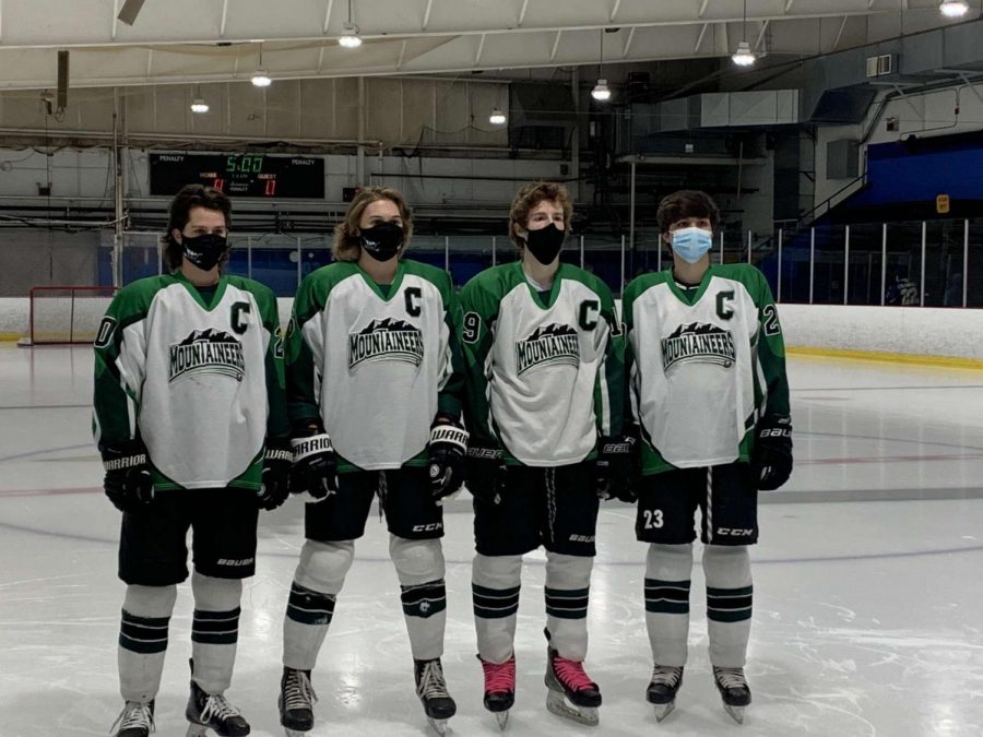 Varsity hockey captains (from left to right) seniors Luke Jodice, Cam Carlson, Michael Iacaboni, and junior Aiden Nicoloro