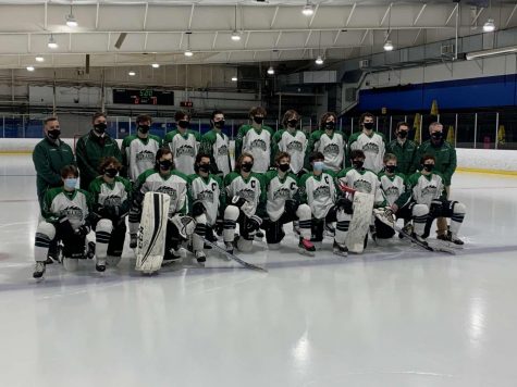 Wachusetts varsity boys hockey team posing for a picture before playing Shrewsbury.