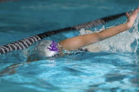 Maura Lemoine doing freestyle during a swim meet.