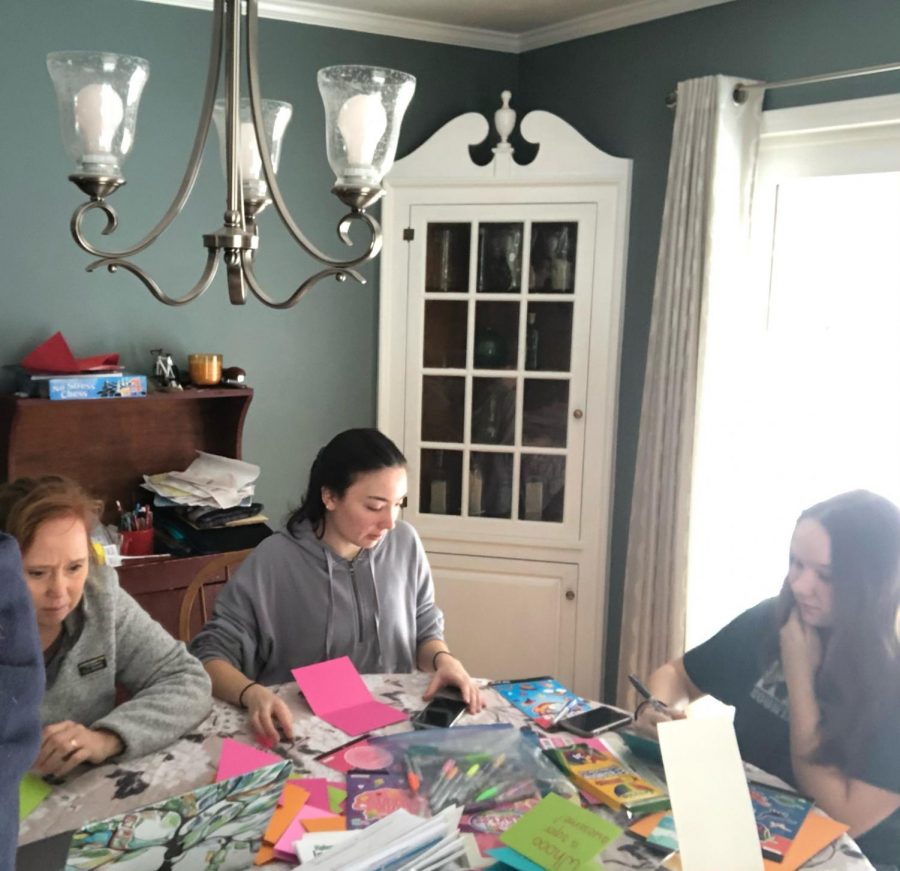 Junior Madeline Snow (in the middle) is joined making cards with her family (Allyson Snow on the left and Lauren Snow on the right).